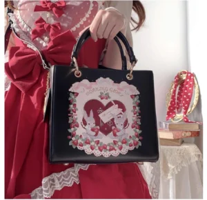 Black PU leather square lolita handbag with pink love heart pattern and handle close-up detail on vintage lace background
