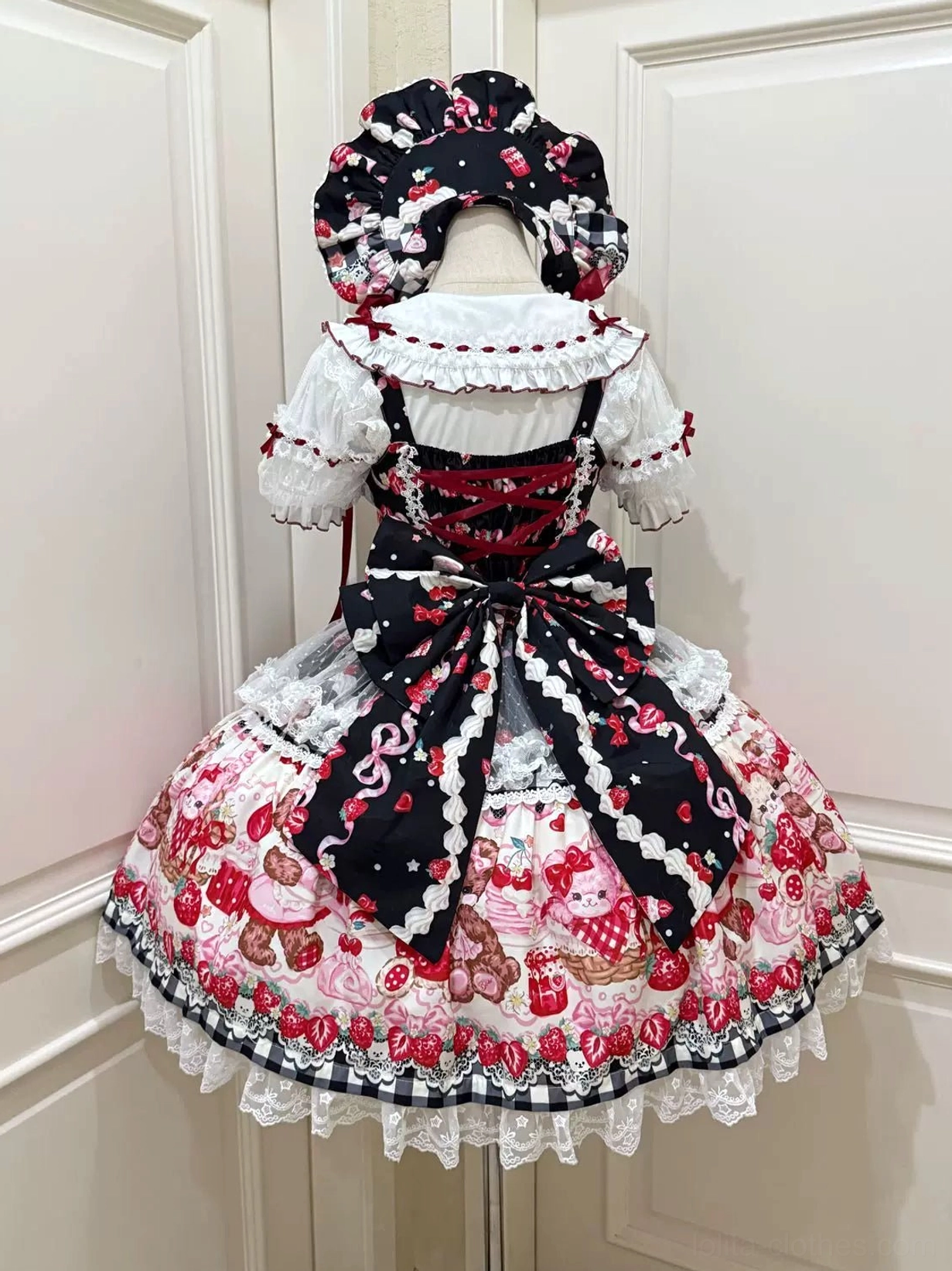 Black base strawberry bear print sweet lolita JSK dress back view with black trailing bow and gingham trim details