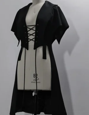 Black swallowtail Ouji Lolita long vest with asymmetrical hem and lace-up corset front displayed on dress mannequin, showing full front design and structured silhouette