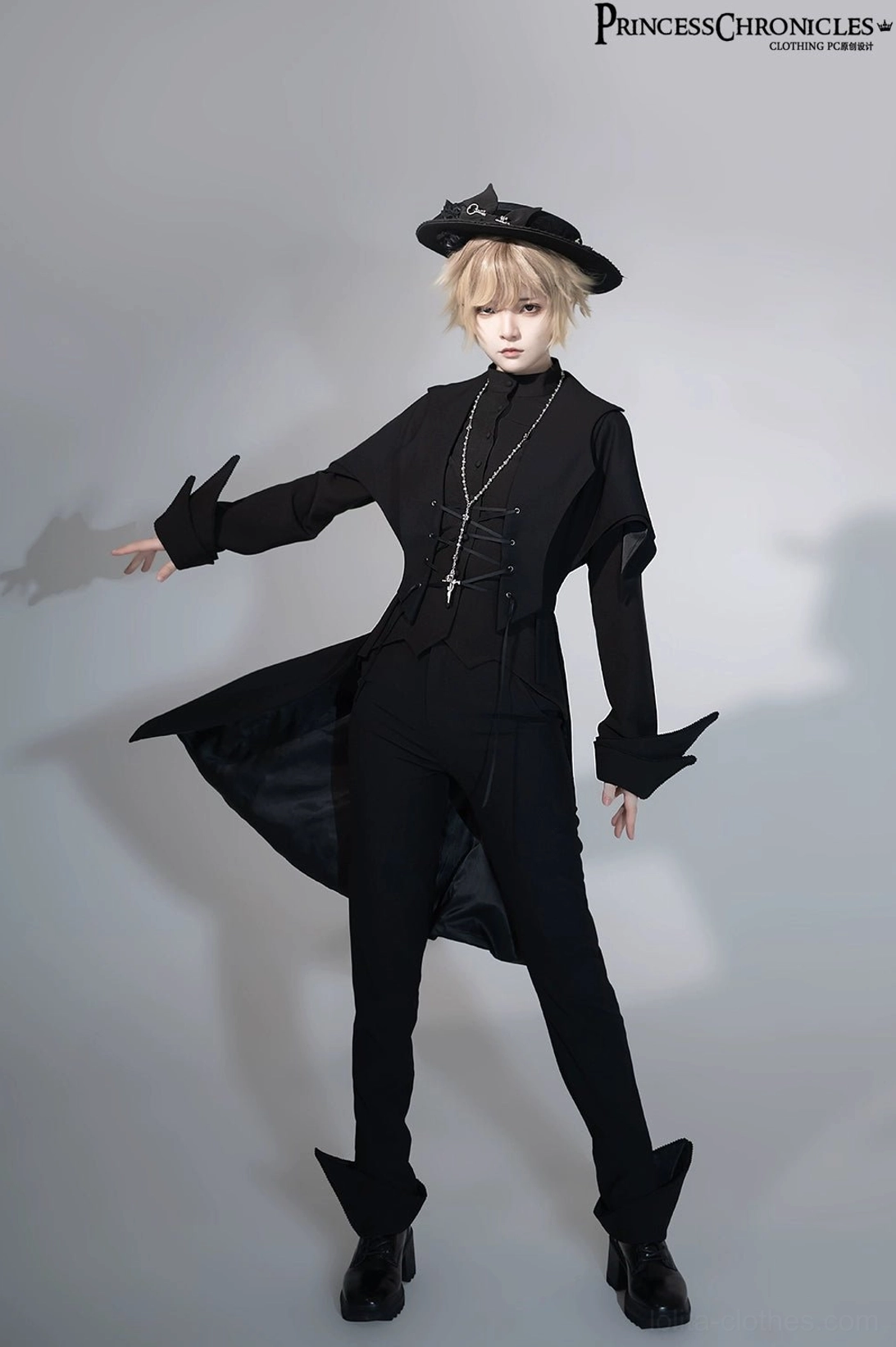 Full-body front view of black Ouji Lolita swallowtail vest on model wearing black bow hat, showcasing structured wide shoulders, fitted waist, and flowing asymmetrical back tail hem