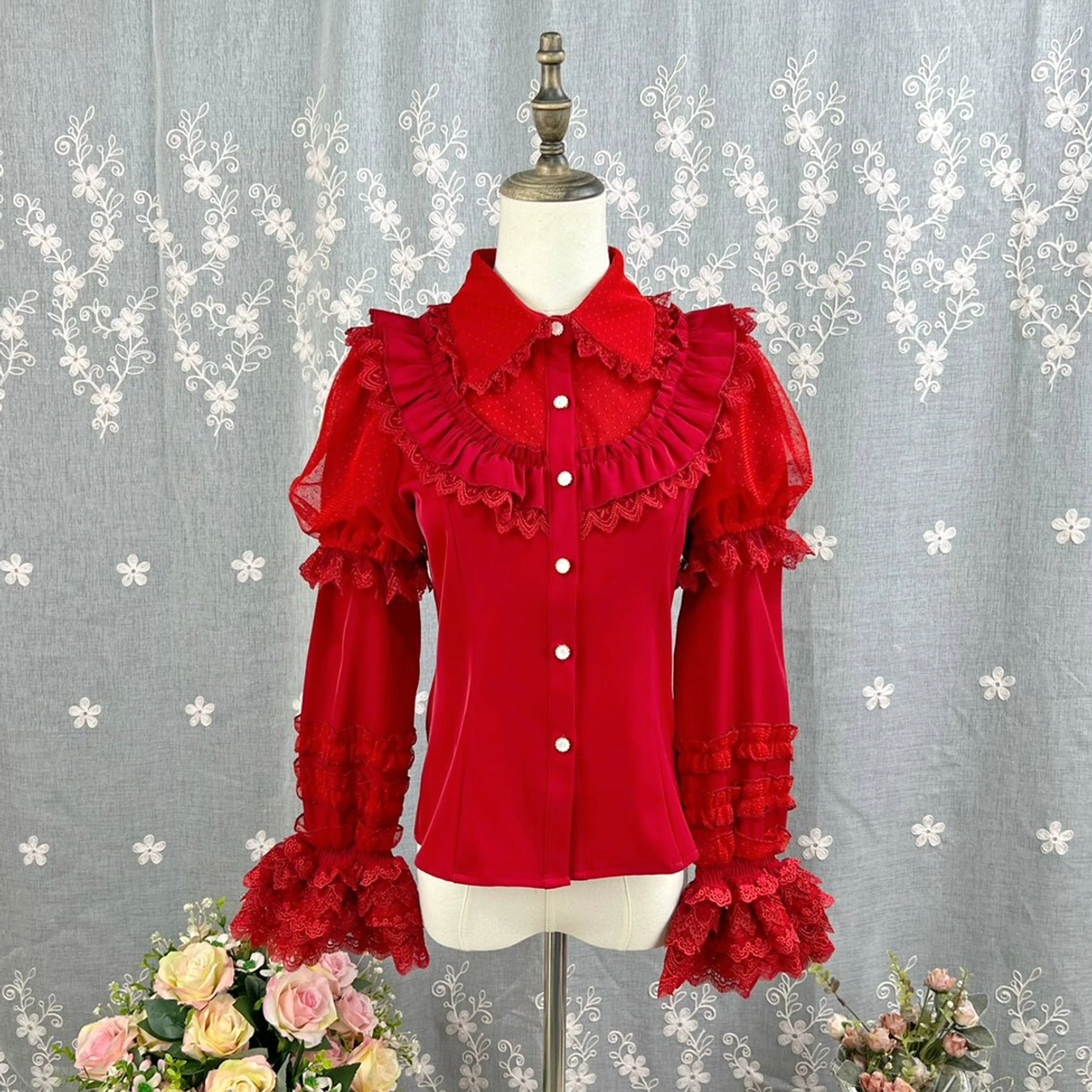 Black sweet lolita short-sleeve blouse with peter pan collar front button closures chest ruffled lace trim short puff sleeves lace edging on dress form red studio backdrop