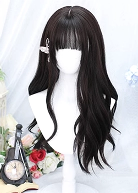 Close-up front view of black tea long curly wavy Lolita wig showing detailed air bangs, butterfly hair clip, natural dark wavy hair texture against vintage floral and retro clock styling