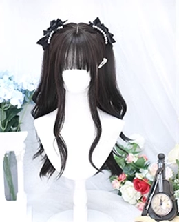 Miniature black tea Lolita wig display on small mannequin head, showing long curly wavy texture with pearl bow hairpins and side hair clip, simplified vintage floral background