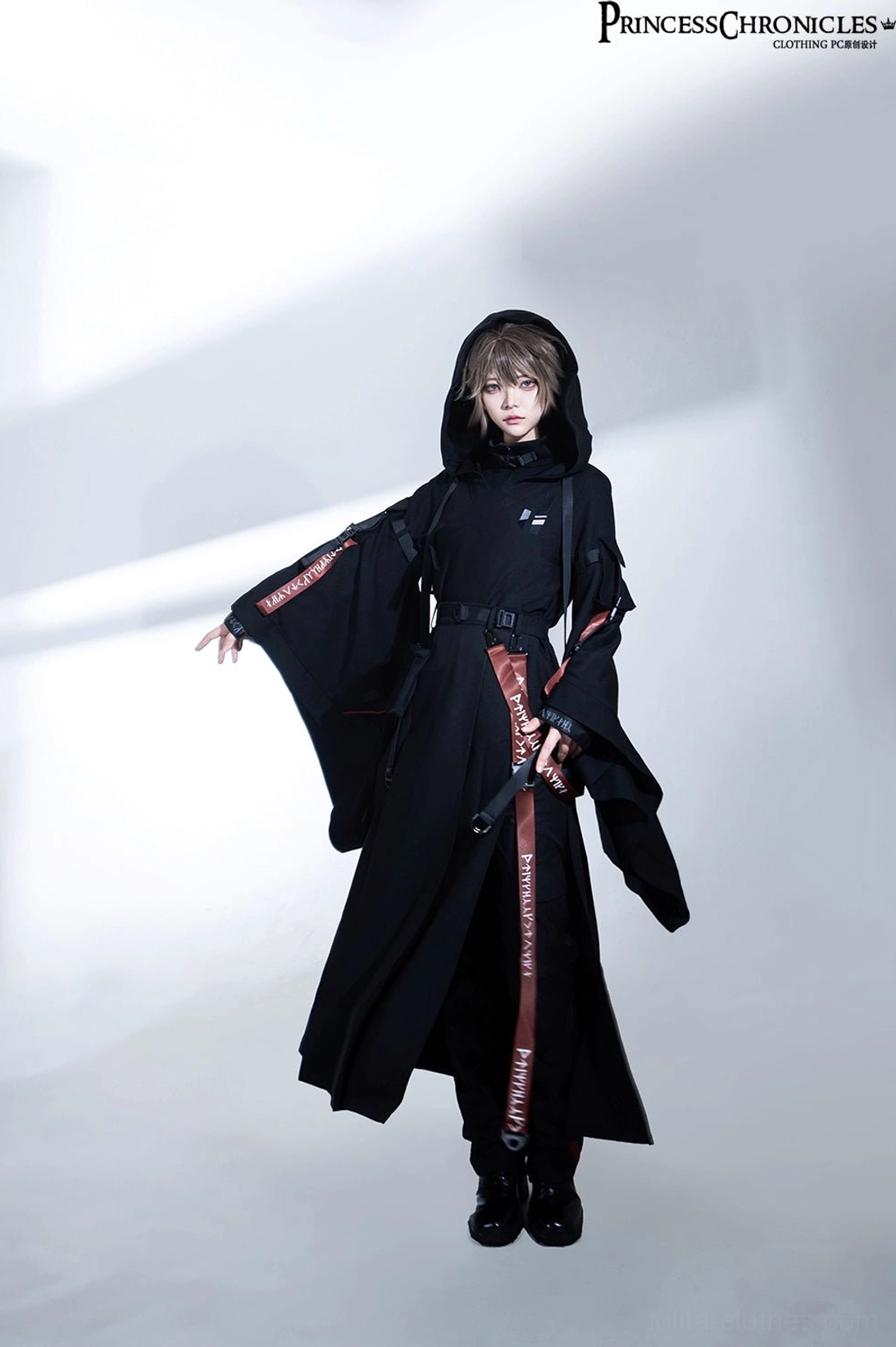 Black techwear A-line skirt front center view showing vertical pleats slimming effect and hem