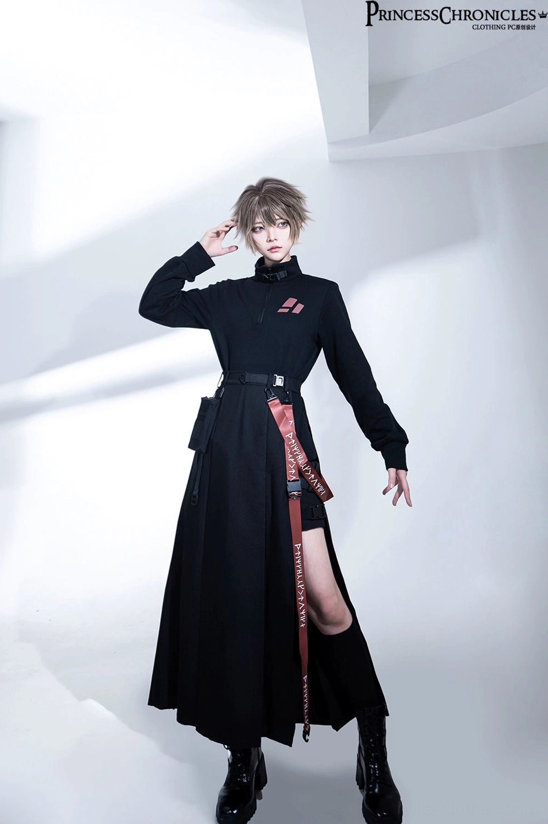 Black techwear skirt and shorts ensemble side profile showing vertical pleats and utility design details