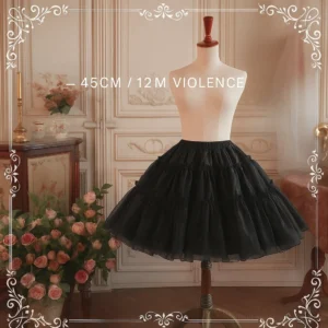 Black tiered Lolita petticoat 45cm displayed on vintage studio backdrop with European furniture showcasing full silhouette and ruffled layers