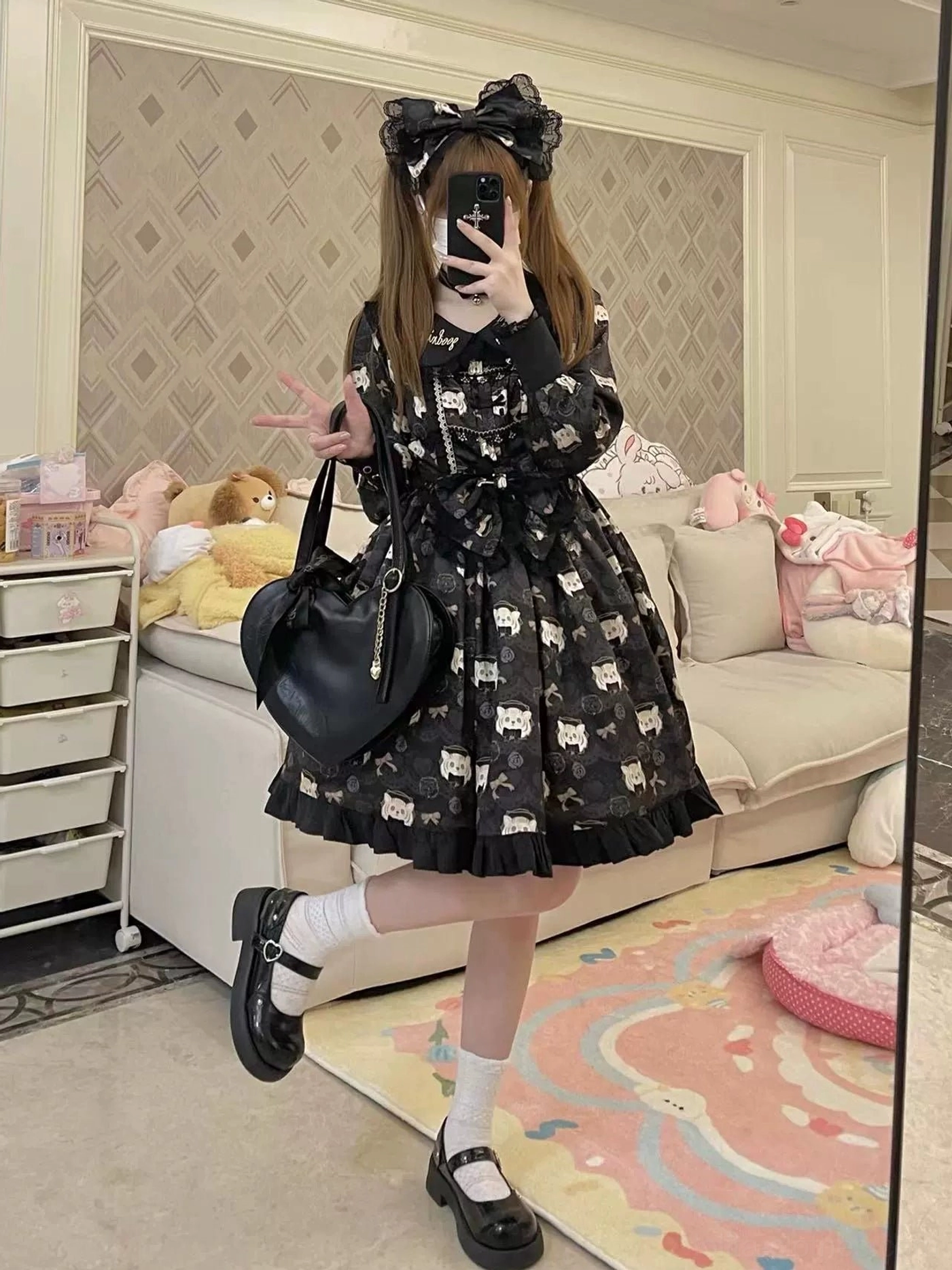Black tiger print lolita OP dress set coordinated outfit with oversized head bow black leather shoulder bag ruffled cuffs and hem details shown in living room mirror selfie