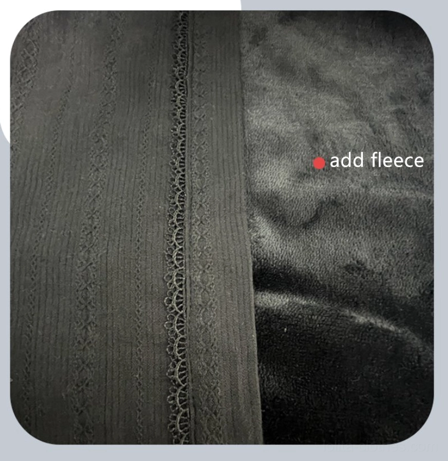 Close-up flat lay detail of black fleece-lined velvet lolita blouse fabric displaying vertical ribbed texture, delicate lace trim on button placket, and plush velvet fleece inner layer marked add fleece