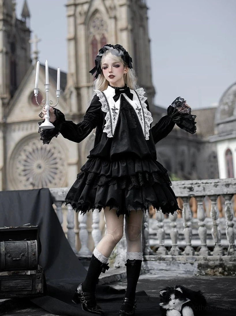 Black velvet gothic lolita one-piece dress with ruffled layered skirt, bishop sleeves with lace trim and smooth velvet fabric texture, model holding black lace parasol at vintage cathedral rooftop