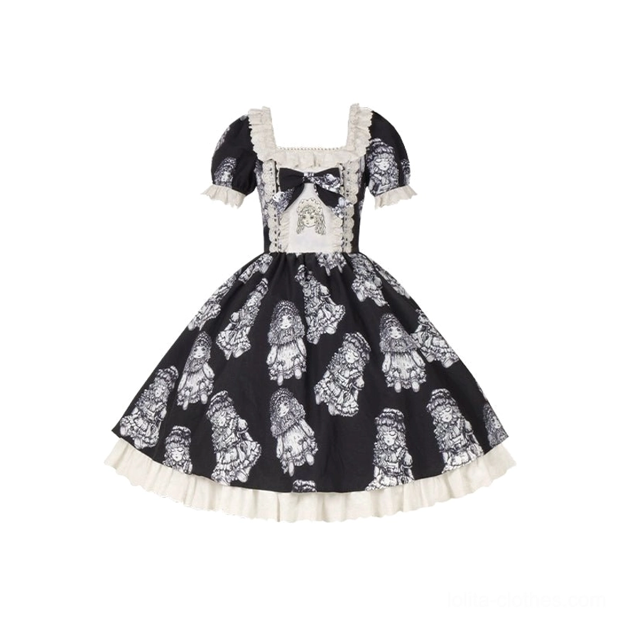 Black vintage lolita OP dress on flat lay mannequin display - black base with white doll print, square lace neckline, puff short sleeves, and front central bow detail