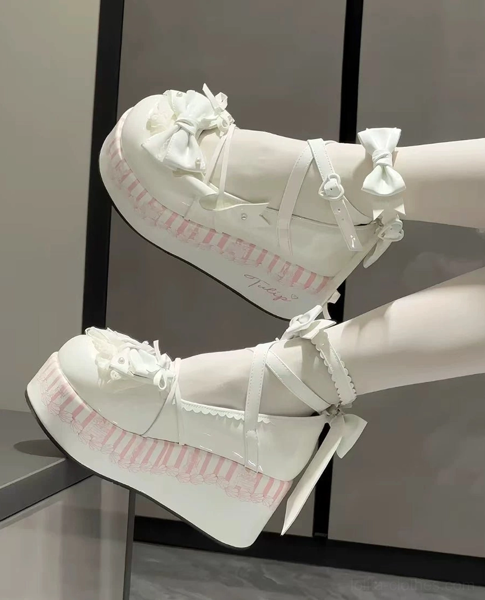 Black and white gothic lolita platform shoes with bow ankle straps and thick platform sole paired with matching lace skirt and gothic lolita styling full outfit view