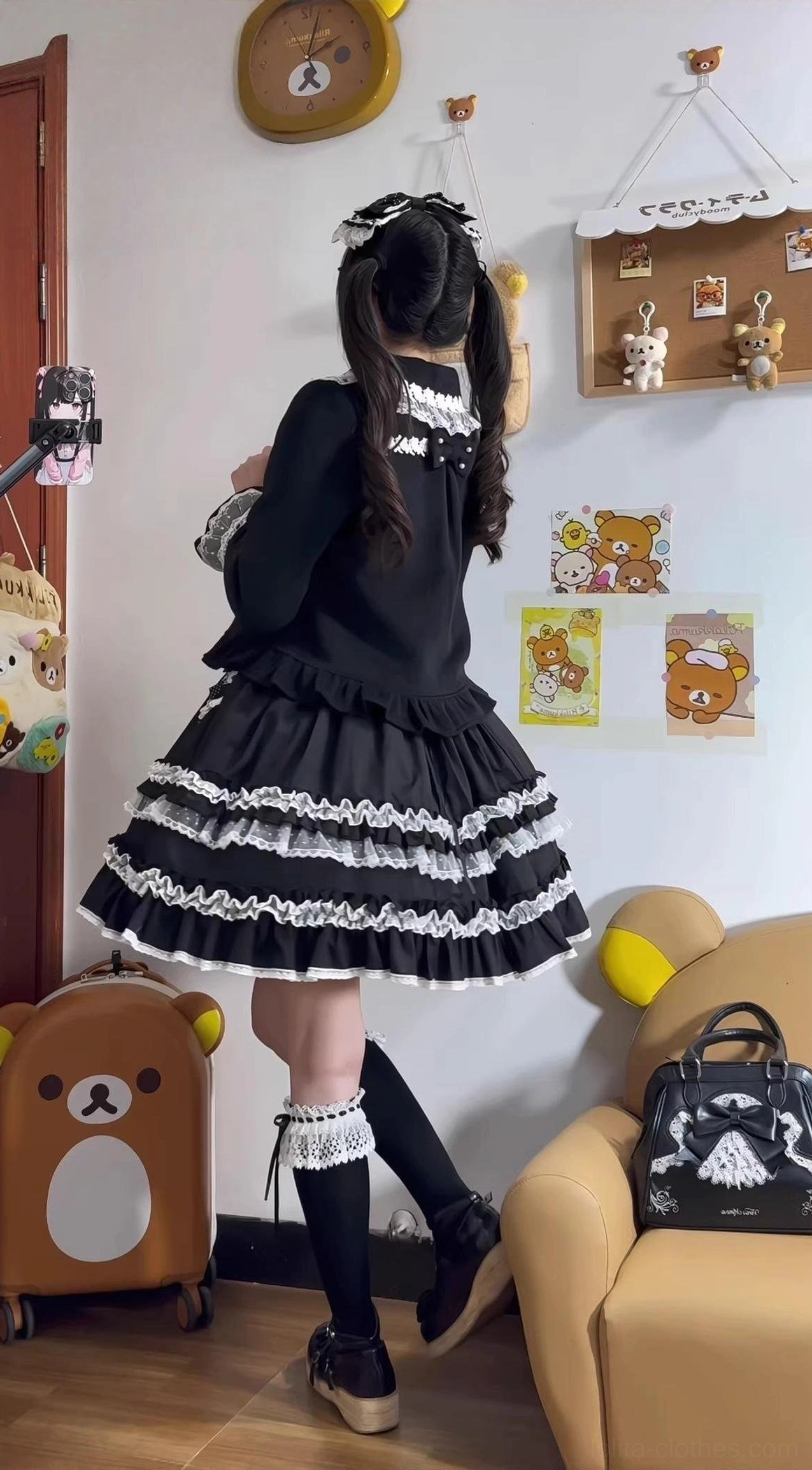 Black and white classic lolita full outfit back view with long-sleeve black top layered ruffle lace skirt and knee-high socks