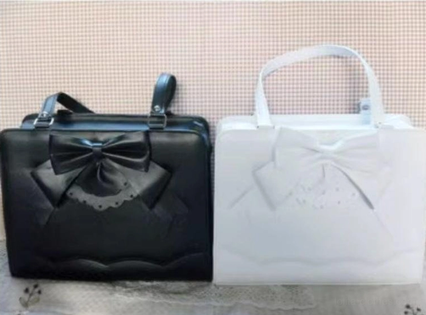 Black and white matching Lolita PU structured handbags with coordinated bow decorations and top handles