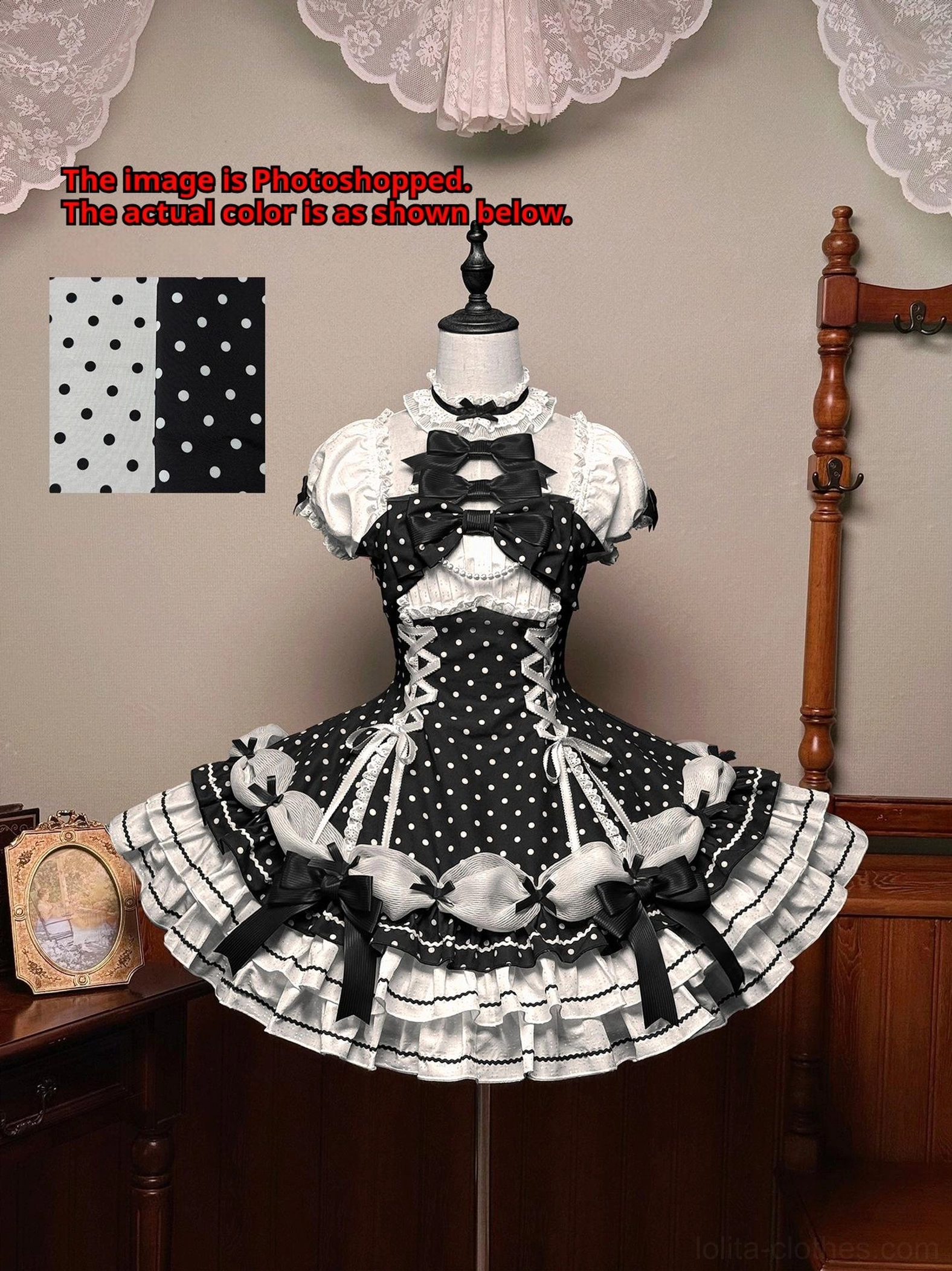 Black and white polka dot Lolita OP dress front full view on mannequin with lace bow decorations layered ruffles vintage studio fabric swatch