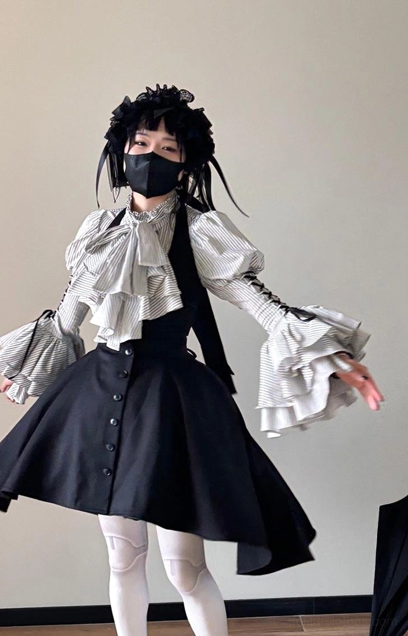 Black with white stripes Gothic Lolita blouse color option on mannequin displaying balanced stripe pattern and monochrome colorway for contemporary Lolita styling approach