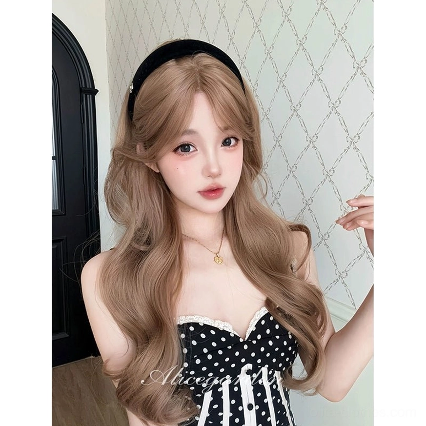 Blonde wavy lolita wig frontal medium shot soft natural wavy hair texture elegant hair fall on model wearing polka dot dress