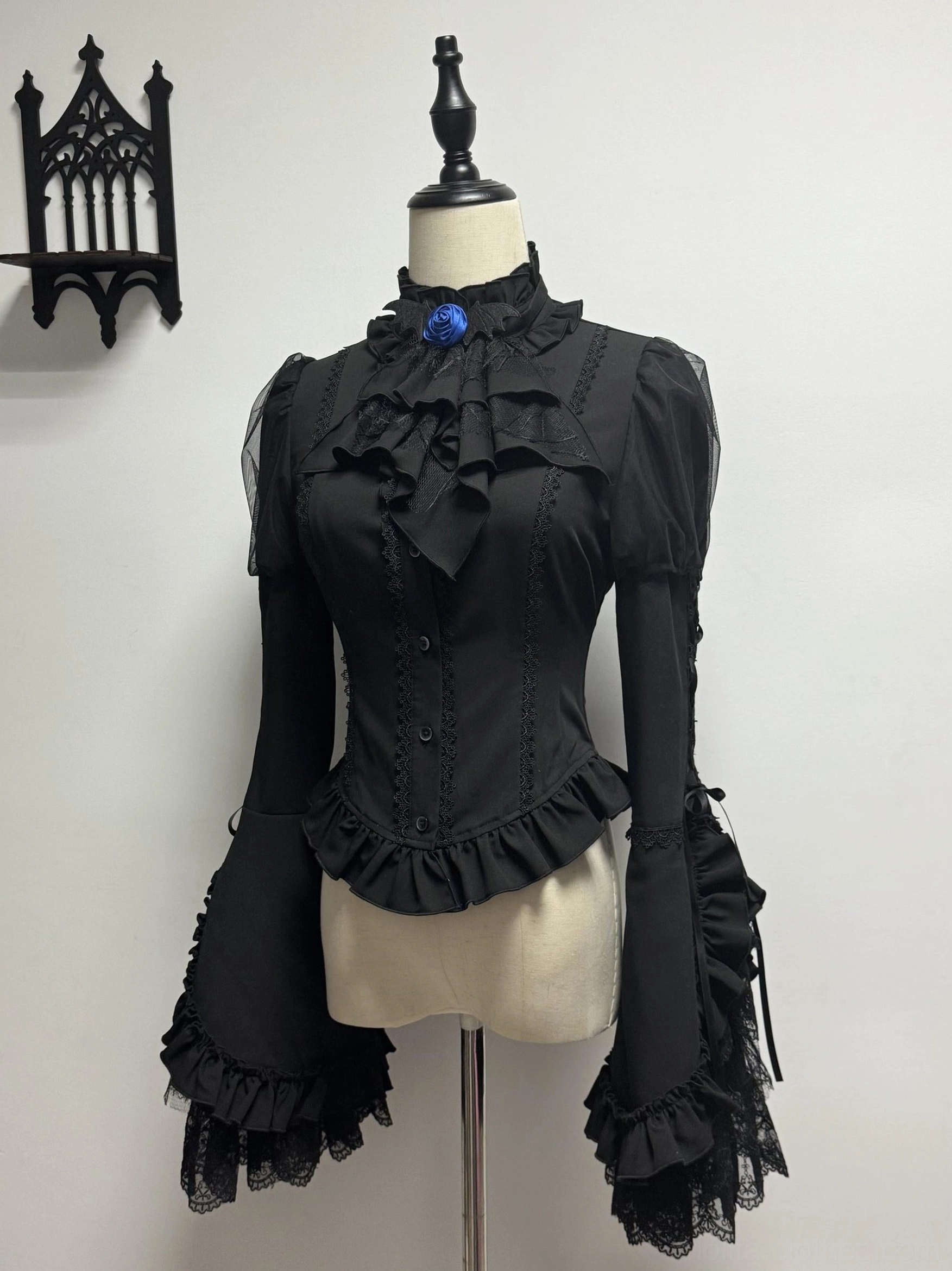 Blue Blood Wedding Gothic Lolita corset blouse top front full view - ruffled stand collar, flared bell sleeves, blue rose brooch decoration, lace-up corset back design, mannequin display