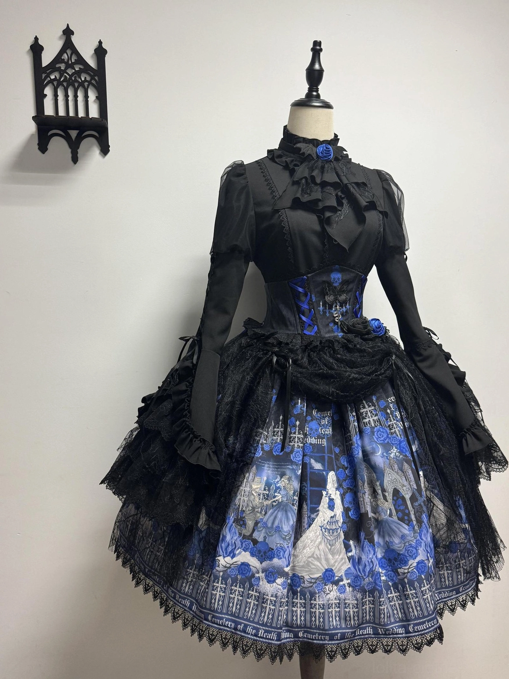 Blue Blood Wedding Gothic Lolita modified full dress set front three-quarter view - blue rose waist decoration, adjusted ruffled long sleeves, matching gothic printed skirt, mannequin styling