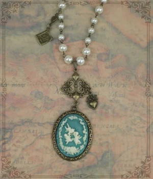 Blue oval cameo lolita necklace with white cherub motifs bronze filigree connector pearl beaded chain vintage style jewelry flat lay