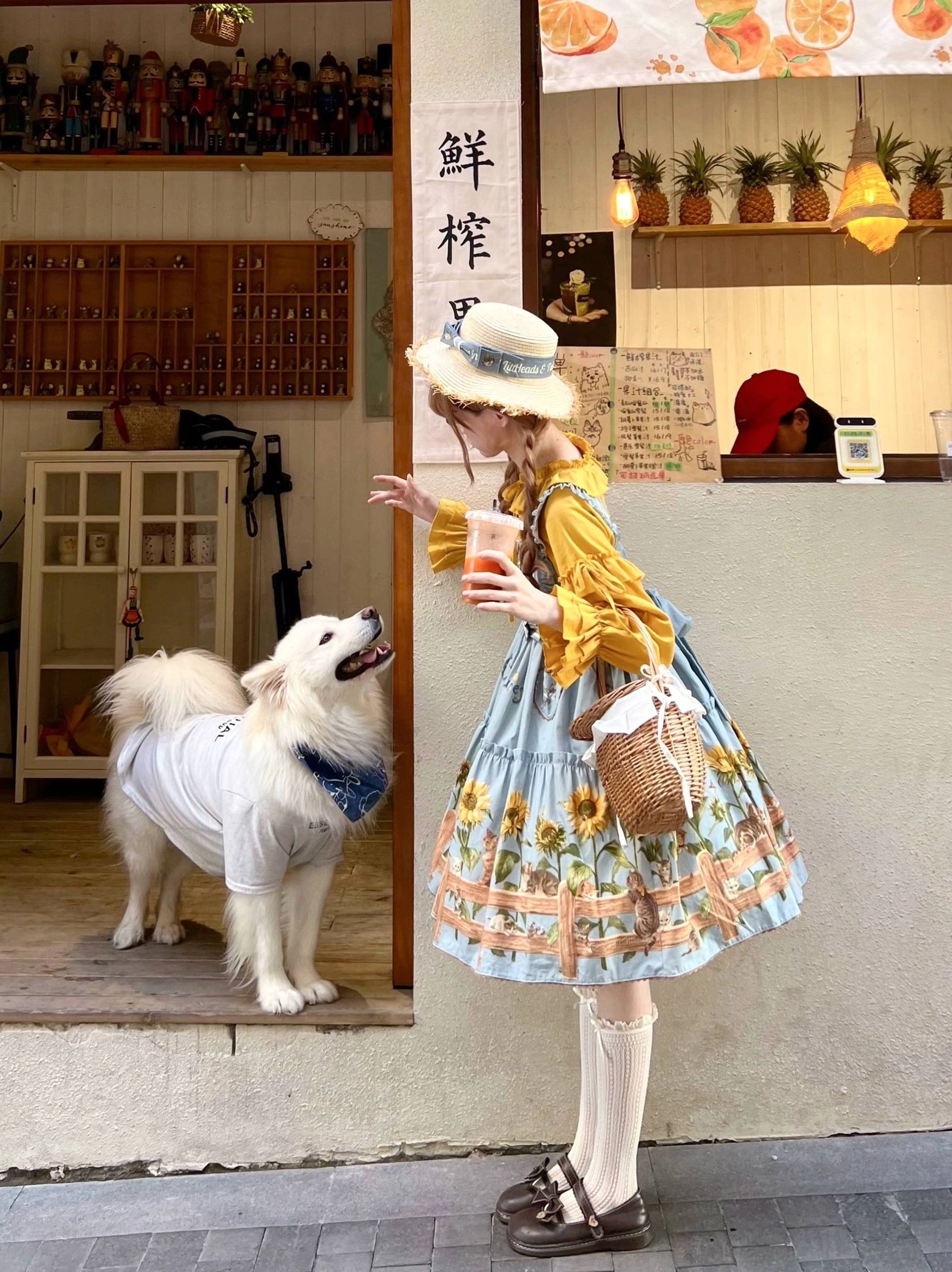 Product display of blue country lolita JSK dress featuring cat and sunflower prints showing full skirt structure