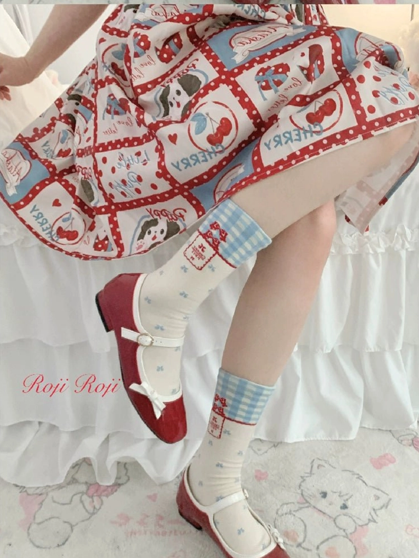 Model lower body side shot blue gingham lolita mid-calf socks delicate bow-dot pattern cream sock body coordinated with vintage print skirt and red patent Mary Jane shoes