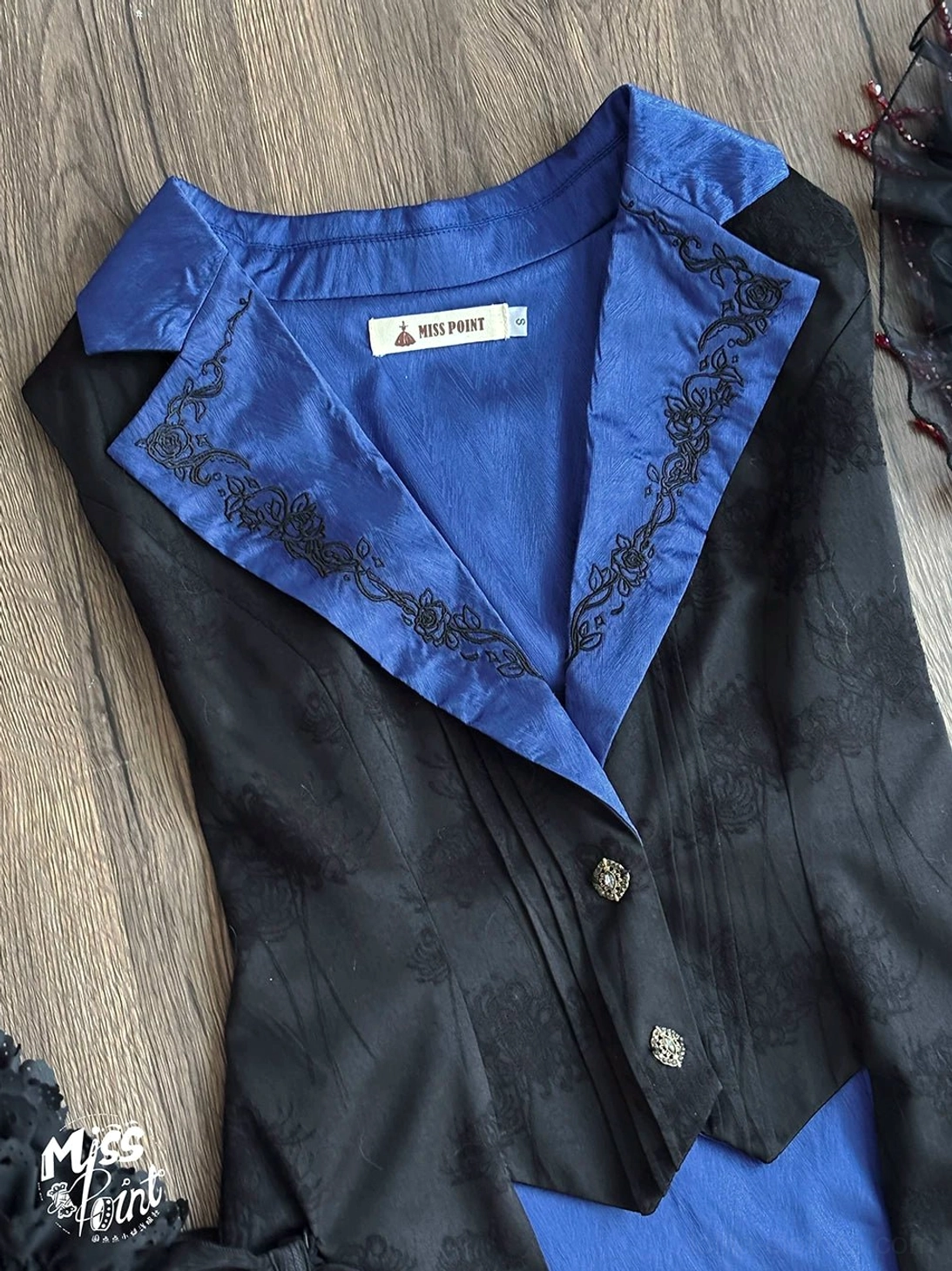 Blue Gothic Lolita long vest with embroidered collar and bright satin lapel flat lay shot