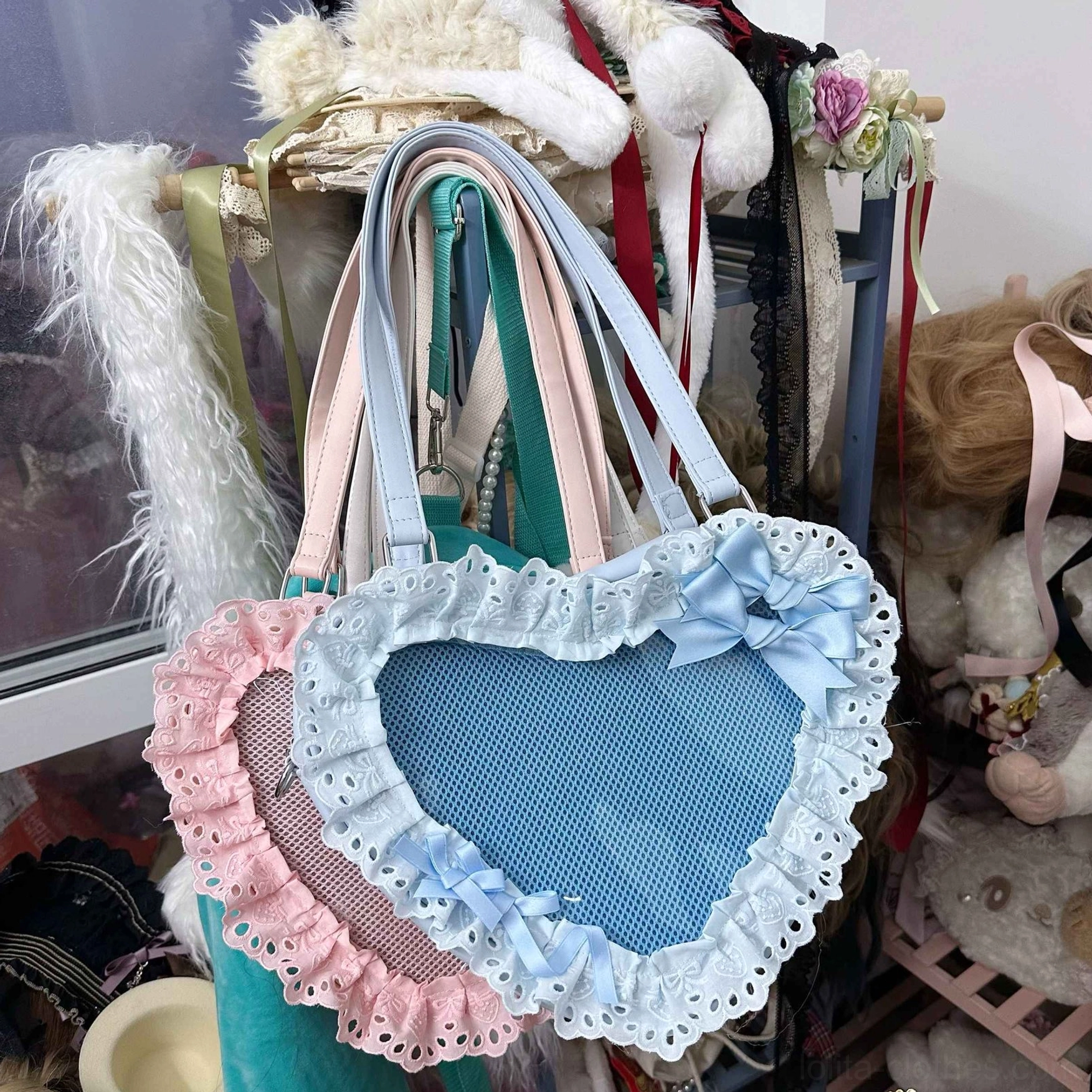 blue heart-shaped lolita shoulder bag pastel blue colorway with lace trim and bow accents