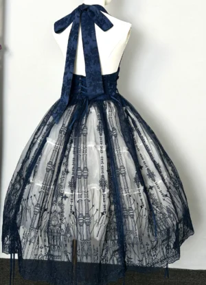 Back view of blue boning mesh gothic lolita skirt with medieval castle embroidery on dress form, displaying halter straps and back lacing corset detail