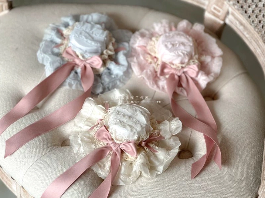 Blue miniature bowler hat lolita head accessory with tiered ruffle border and cascading satin ribbon decoration