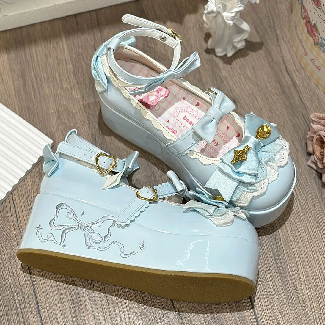 Blue mousse roll platform sweet lolita shoes multiple angle view displaying patent leather finish bow decorations and platform sole design