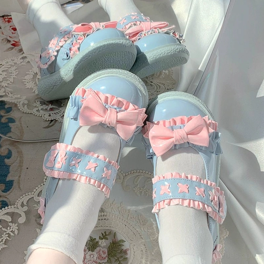 Blue pink Lolita shoes styled in soft romantic coordinate with pastel colors, dreamy aesthetic and whimsical fairy tale inspired accessories and props