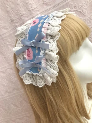 Blue rose carousel sweet lolita headdress with scalloped lace trim and dual matte bows worn on blonde wig mannequin, showing left side-view perspective and delicate argyle print details