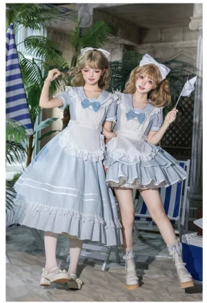 Blue striped sailor collar lolita OP dress front three-quarter view beach resort setting two models short and long length versions