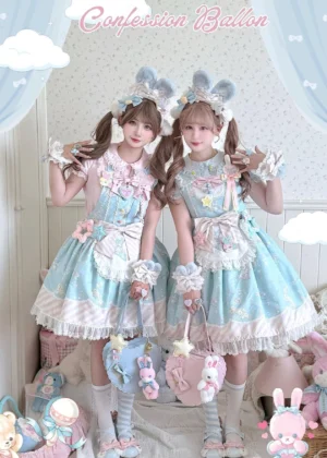 Half-body standing view of blue bunny-themed sweet Lolita jumper skirt with models wearing bunny ear headwear and twin tails, displaying lace hem, bow details, and star bunny print patterns in cute indoor room with plush toys