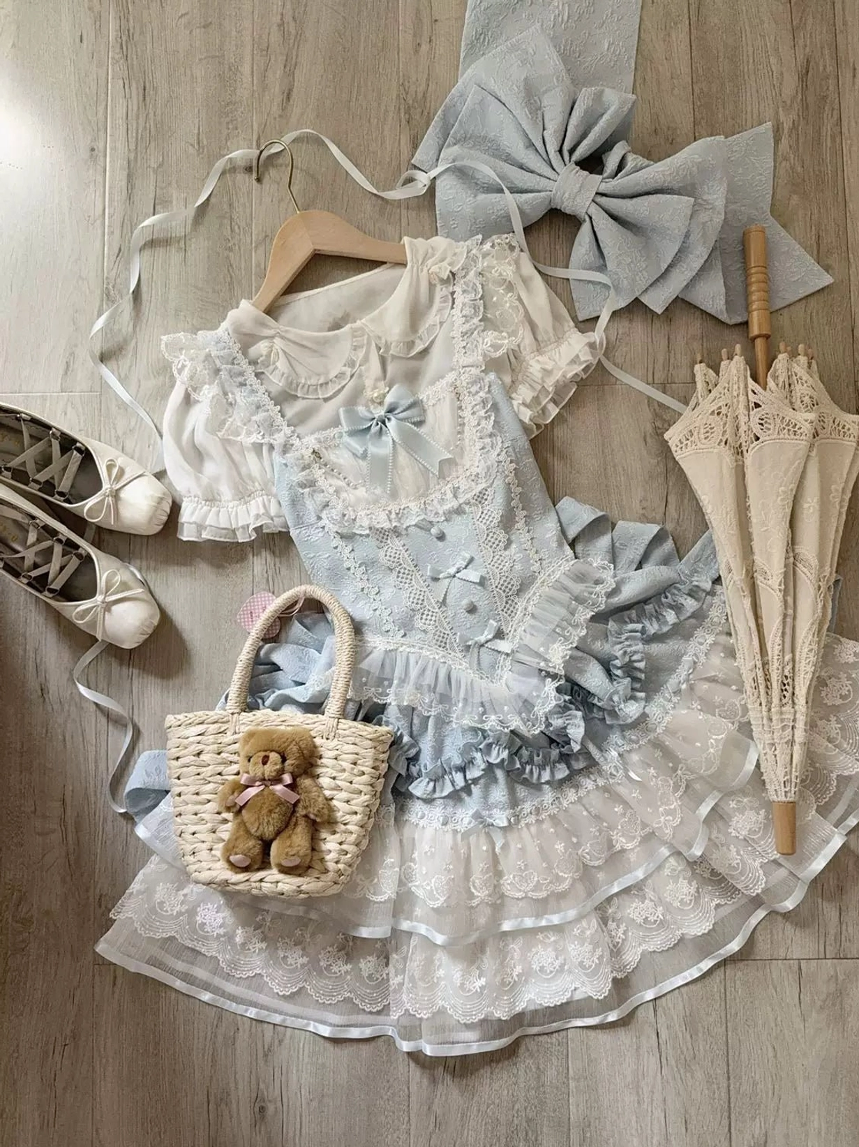 Blue sweet lolita JSK dress variant shown on dress form displaying blue-toned petal ruffles, lace details, and the classic silhouette of this lolita jumper skirt style