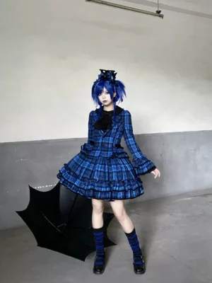 Blue tartan plaid lolita dress worn by model with black umbrella and twin-tail hairstyle