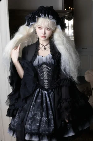 Gothic Lolita full outfit featuring JSK dress and bolero with front close-up showing corset bodice ruffled sheer sleeves and ornate gothic print fabric details