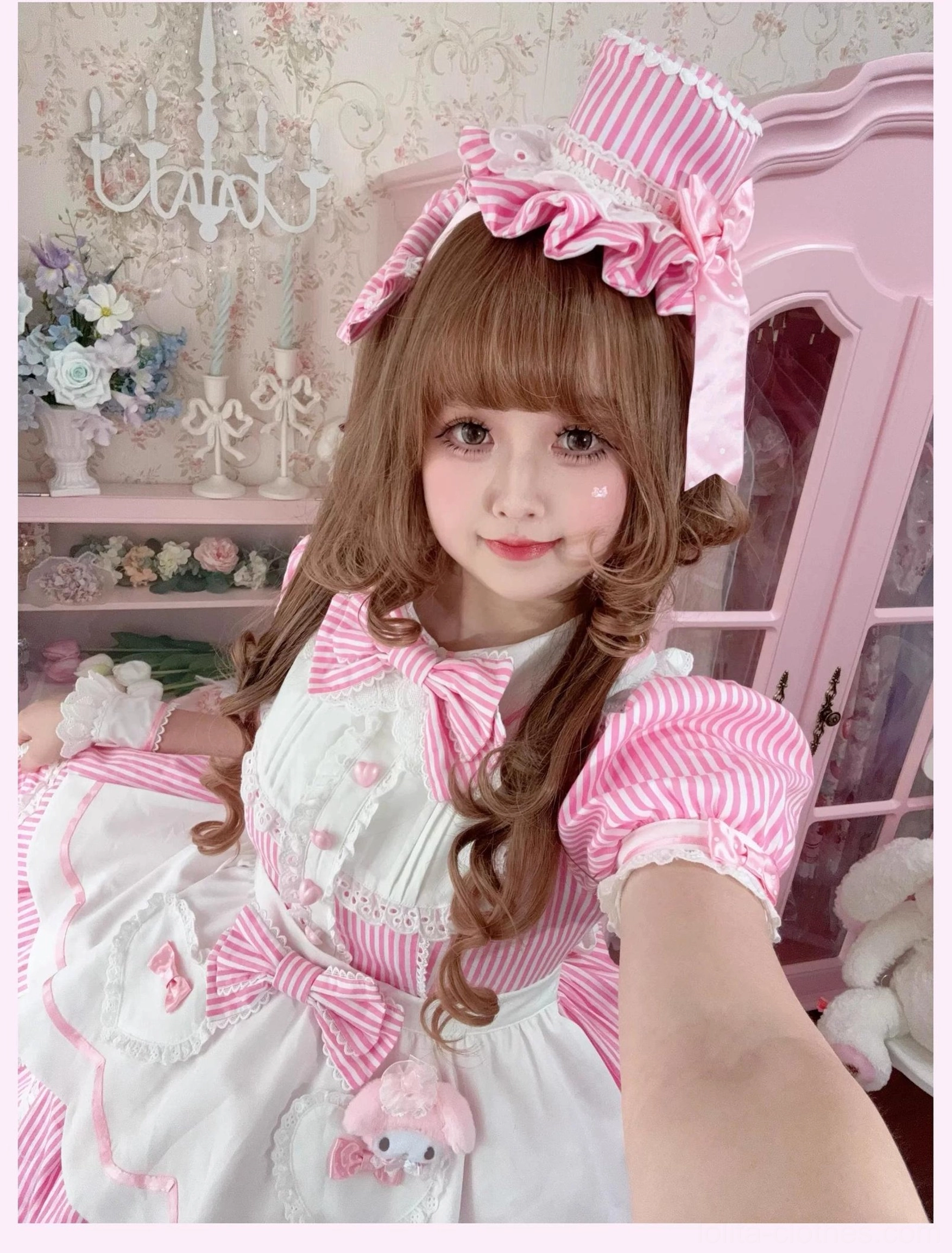 Bonnet and cuff accessories laid flat showing individual styling pieces and heart-shaped button detail
