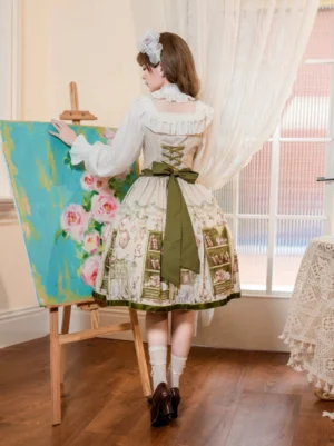 Back view of bookstore print Lolita JSK dress showcasing back shirring design and olive green bow detail, worn with white long-sleeve ruffled blouse
