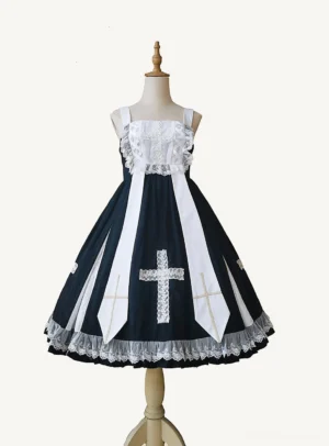 Black and white gothic lolita jumper skirt front view flat lay on wooden dress form with white cross print and lace trim details