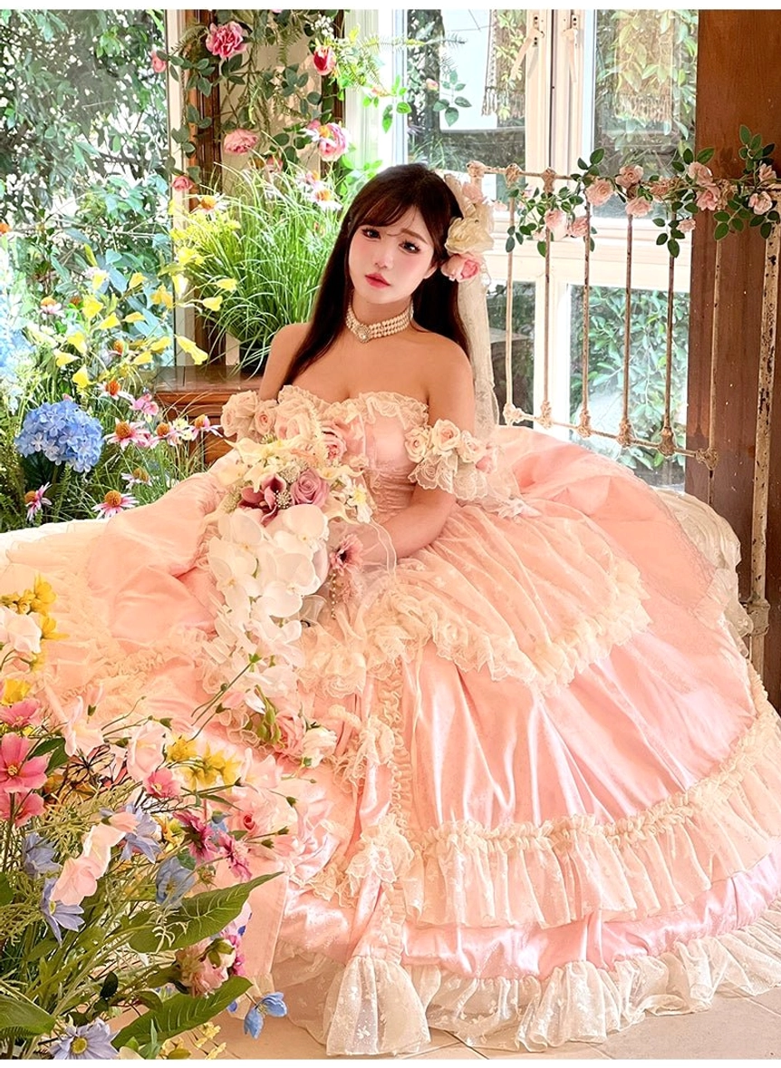Paired accessory detail showing bonus clear shoulder straps for bridal lolita wedding dress support