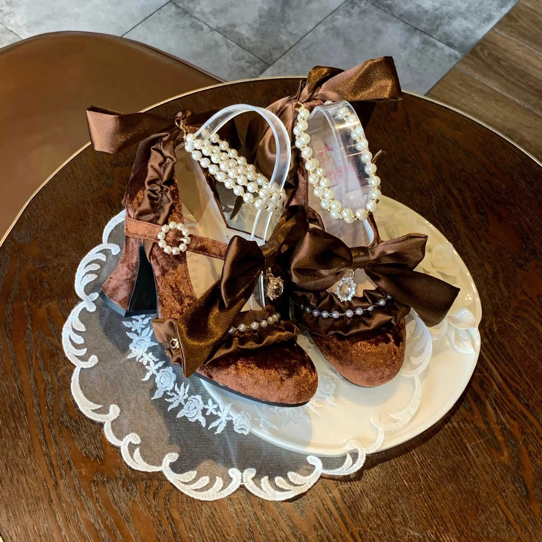 Brown Classic Lolita high heel shoes with pearl ankle strap and satin bow, perfect for Romantic and Classic Lolita coordinates with vintage aesthetic