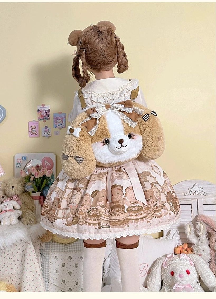 Brown Cocker Spaniel plush lolita backpack worn by model in sweet lolita bear-themed dress with twin curly buns, back view