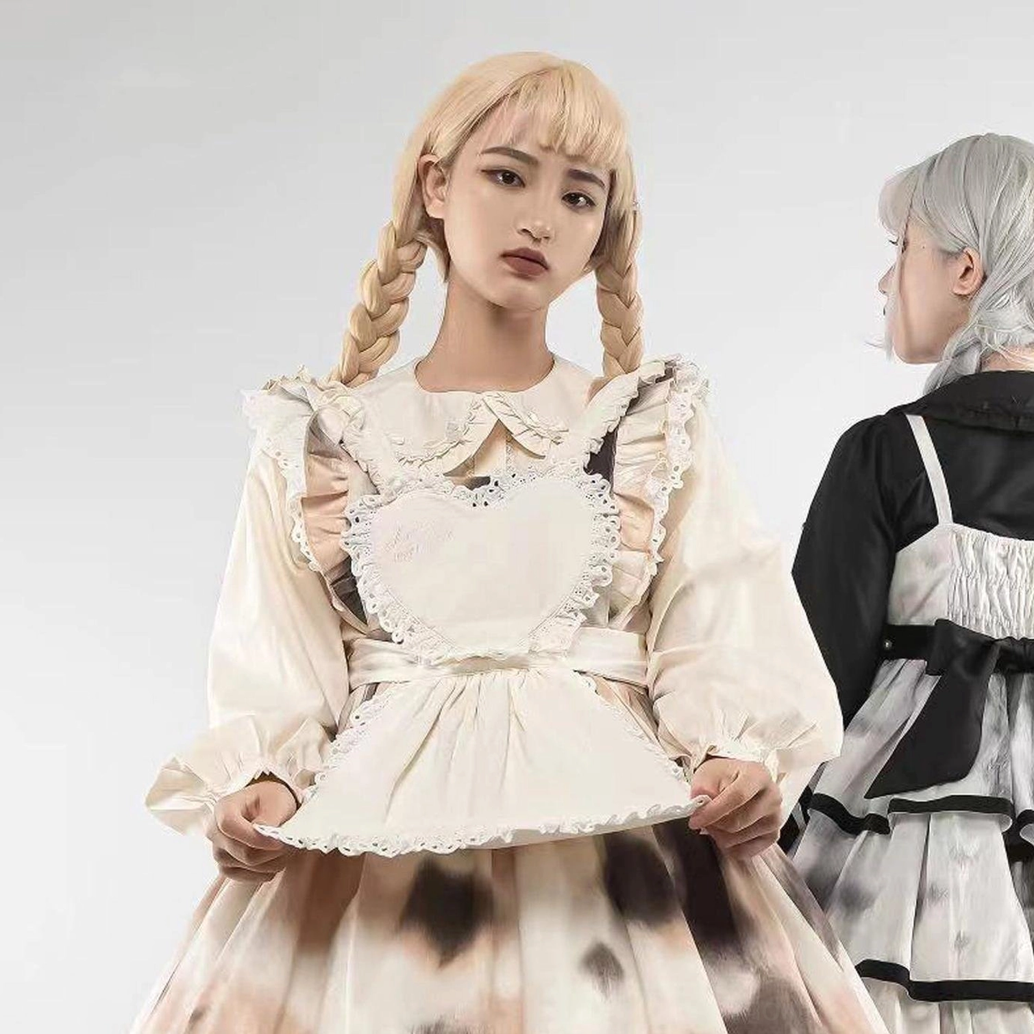 Brown cow print maid lolita dress blonde model twin braids ruffled doll collar bubble sleeves heart apron studio