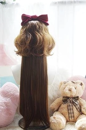 Back view of brown jellyfish curly lolita wig showing voluminous short curly hair and long straight ponytail with burgundy bow