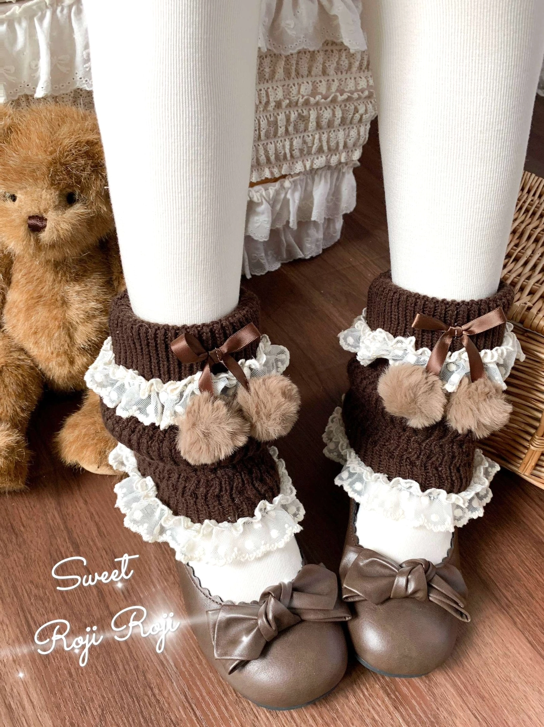 Brown lolita leg warmers with pom-pom bows and lace ruffles, complete product view showing color depth, design details, and authentic kawaii construction quality