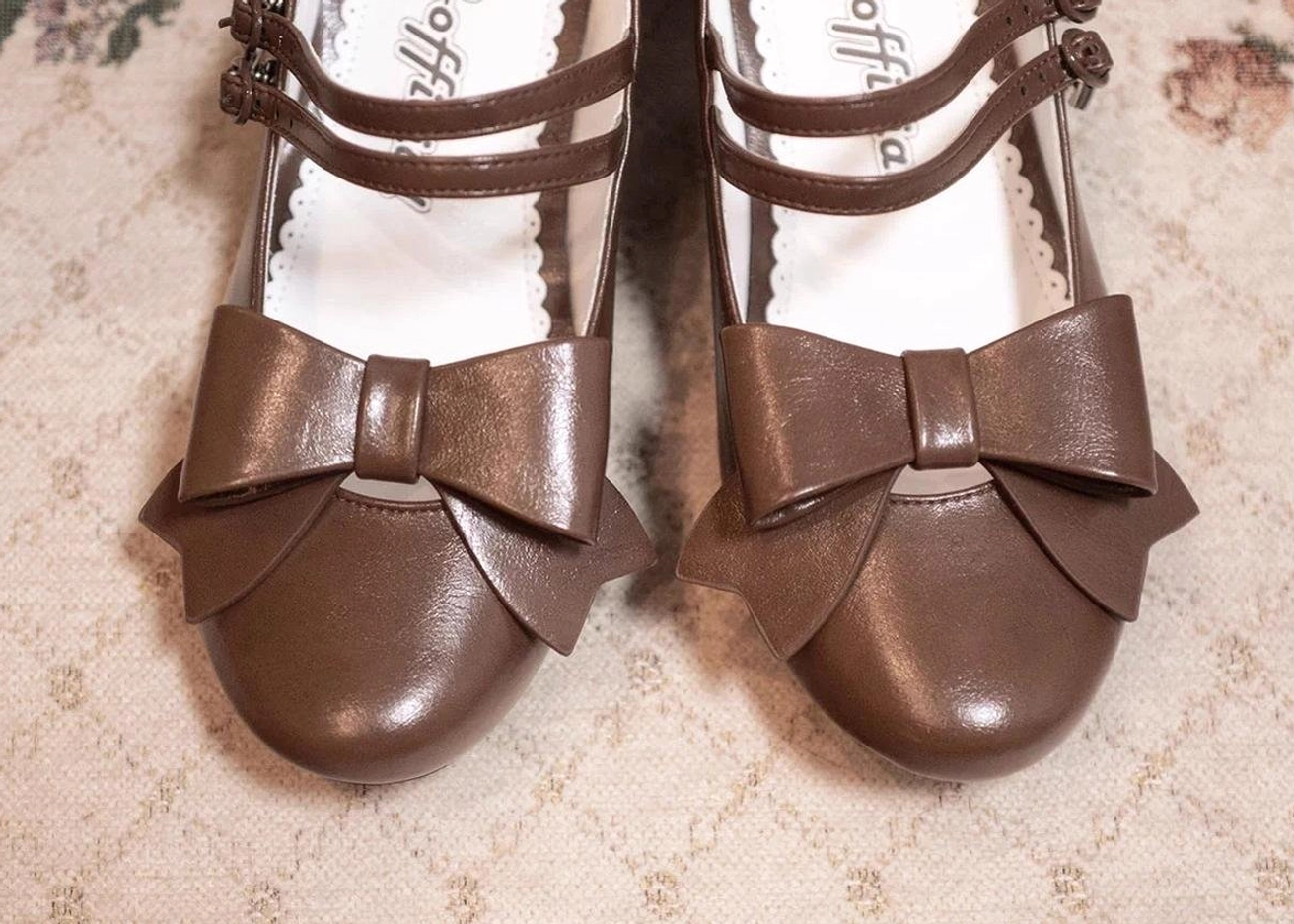 Brown Lolita Mary Jane shoes detailed side view profile low block heel ankle strap bow decoration pointed toe silhouette elegant footwear design