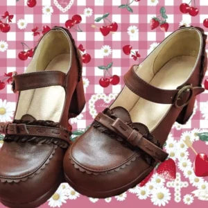 Handcrafted brown Mary Jane lolita shoes with decorative lace bow flat lay overhead view vintage aesthetic