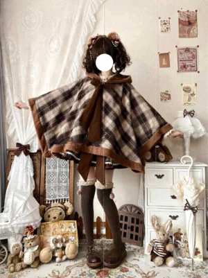 Dark brown tweed plaid lolita cape cloak with brown fuzzy edge trim side back full body shot oversized fit vintage bedroom backdrop