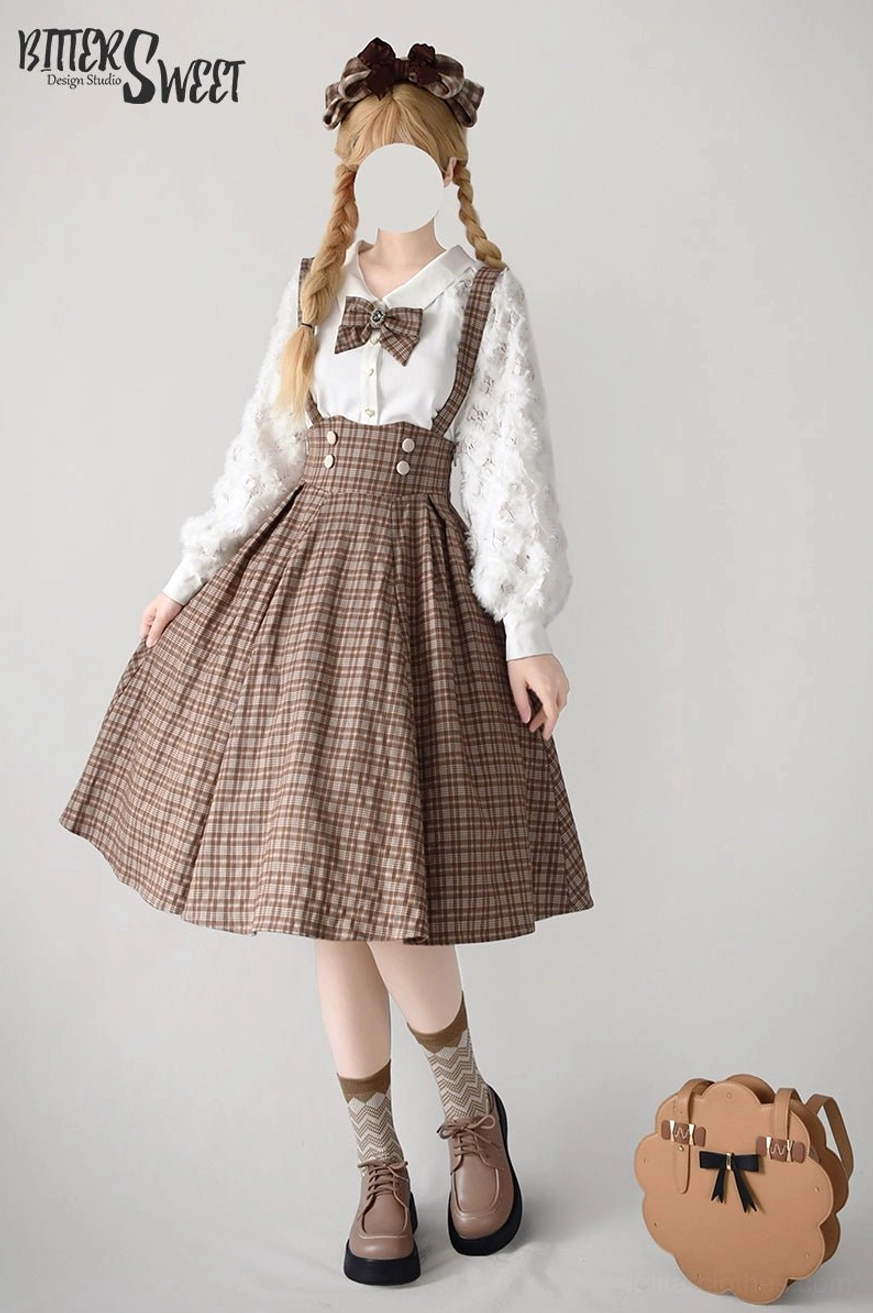 Brown plaid Lolita skirt front three-quarter shot with twin braids, matching white blouse and platform shoes, ground-level view showing flower handbag and complete sweet Lolita coordination